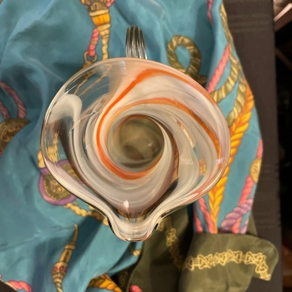 Vintage hand blown art glass swirl pitcher with applied handle.